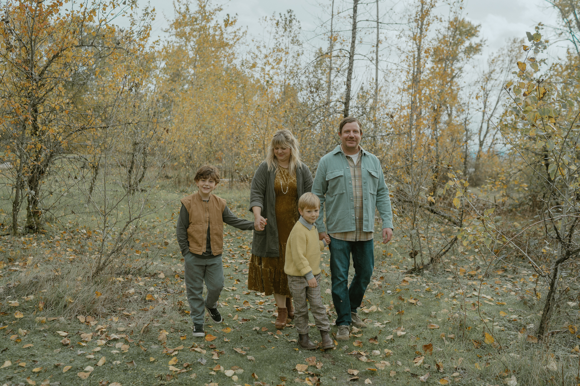 family walking through woods