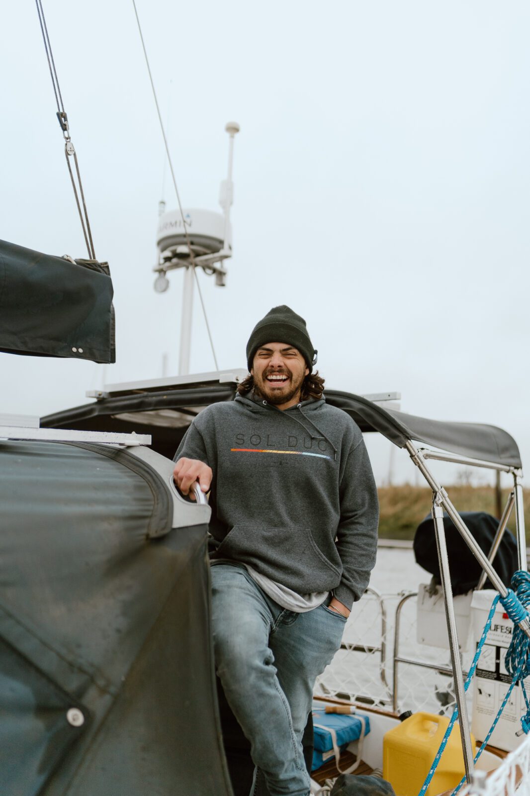 man on sailboat, laughing