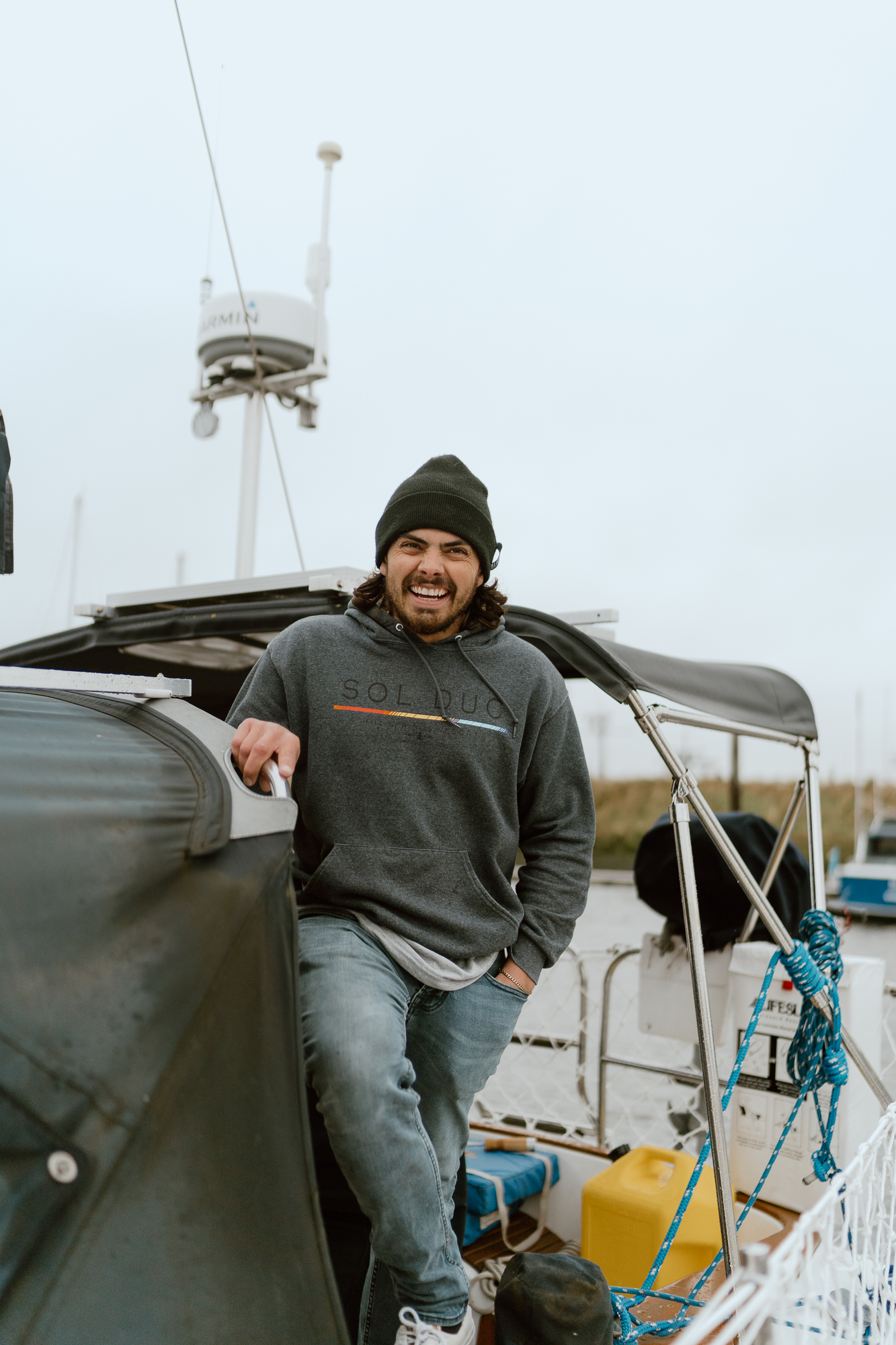 man on sailboat, laughing, sailing with phoenix