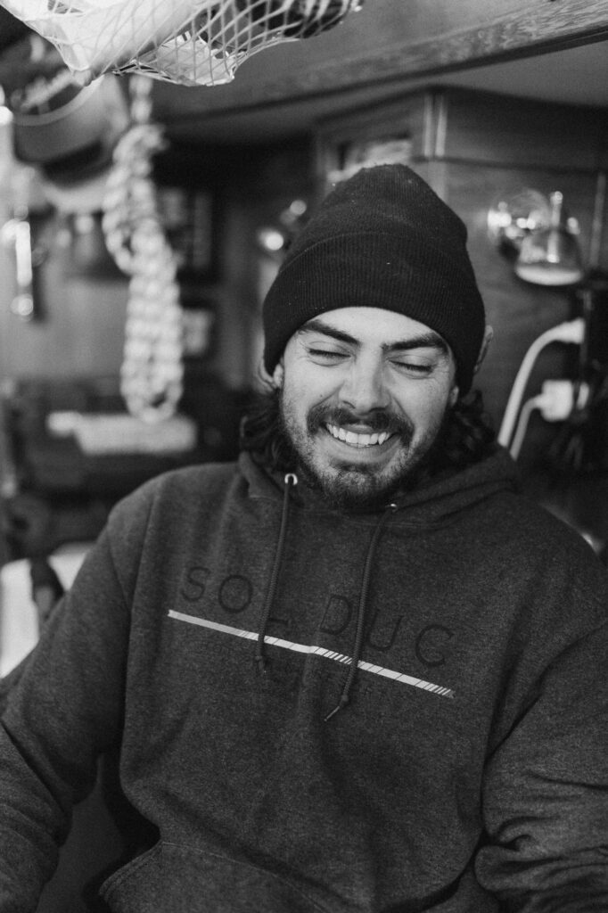 man smiling inside boat