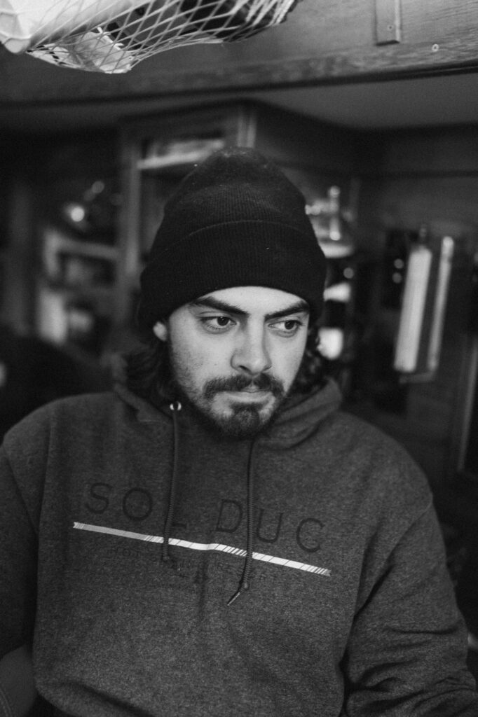 black and white, sailor inside boat